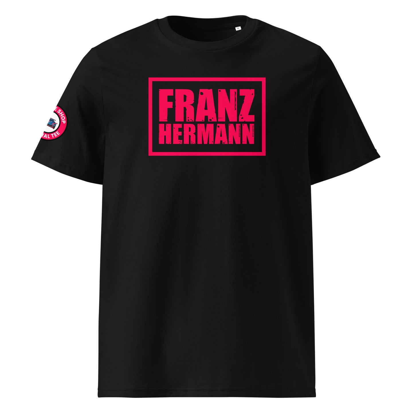 Front view of black unisex t-shirt with bold, distressed Red Bull Racing pink “Franz Hermann” box logo printed on the chest. DTF print, inspired by Verstappen’s Nürburgring GT3 moment. Modern F1 fan style.