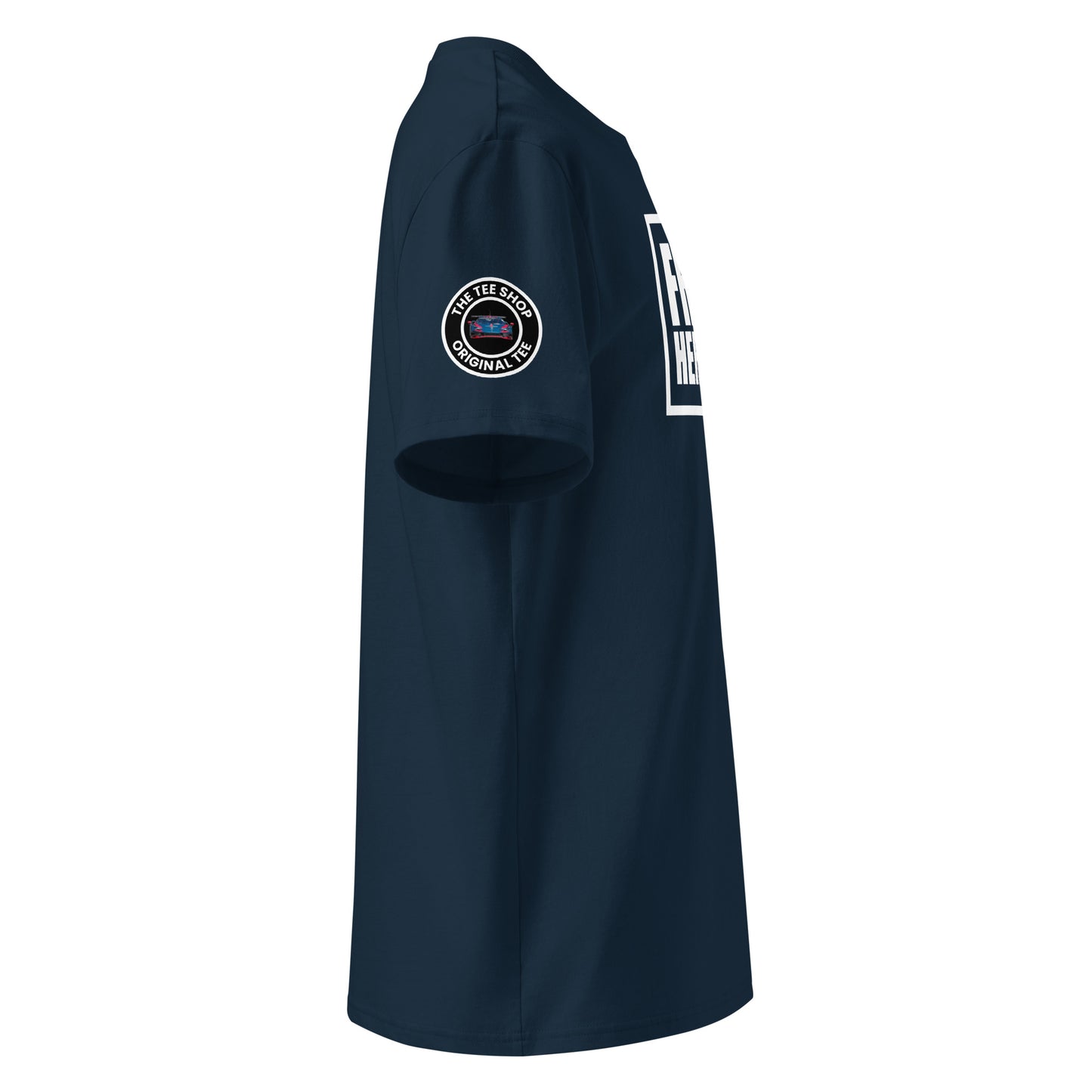 Right side view of French navy t-shirt showing The Tee Shop’s circular logo patch on the sleeve and the edge of the white Franz Hermann box logo. DTF printed, designed for F1 and GT3 fans.