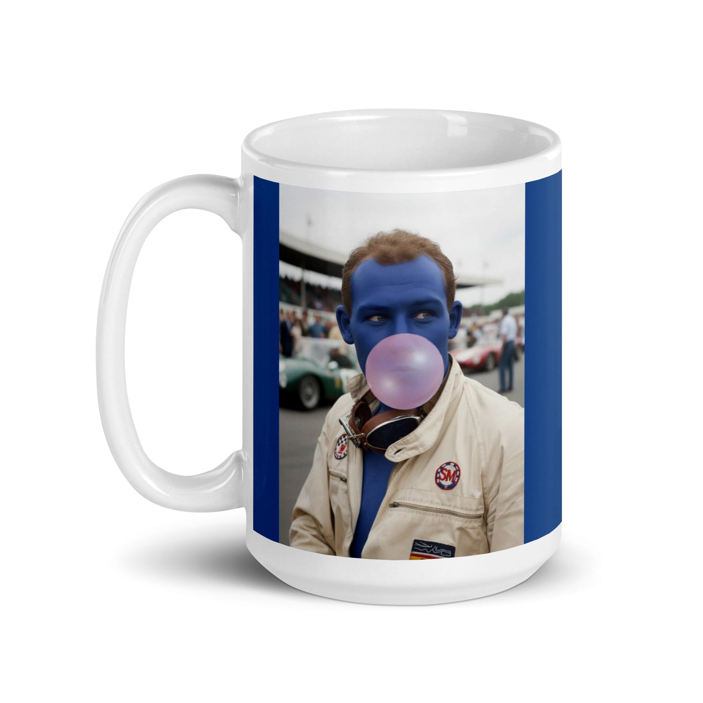 White ceramic 15oz mug with a bold blue border featuring a pop-art style portrait of Stirling Moss in a white racing suit, blue-tinted face, and blowing a pink bubblegum bubble, with a vintage racetrack scene in the background.