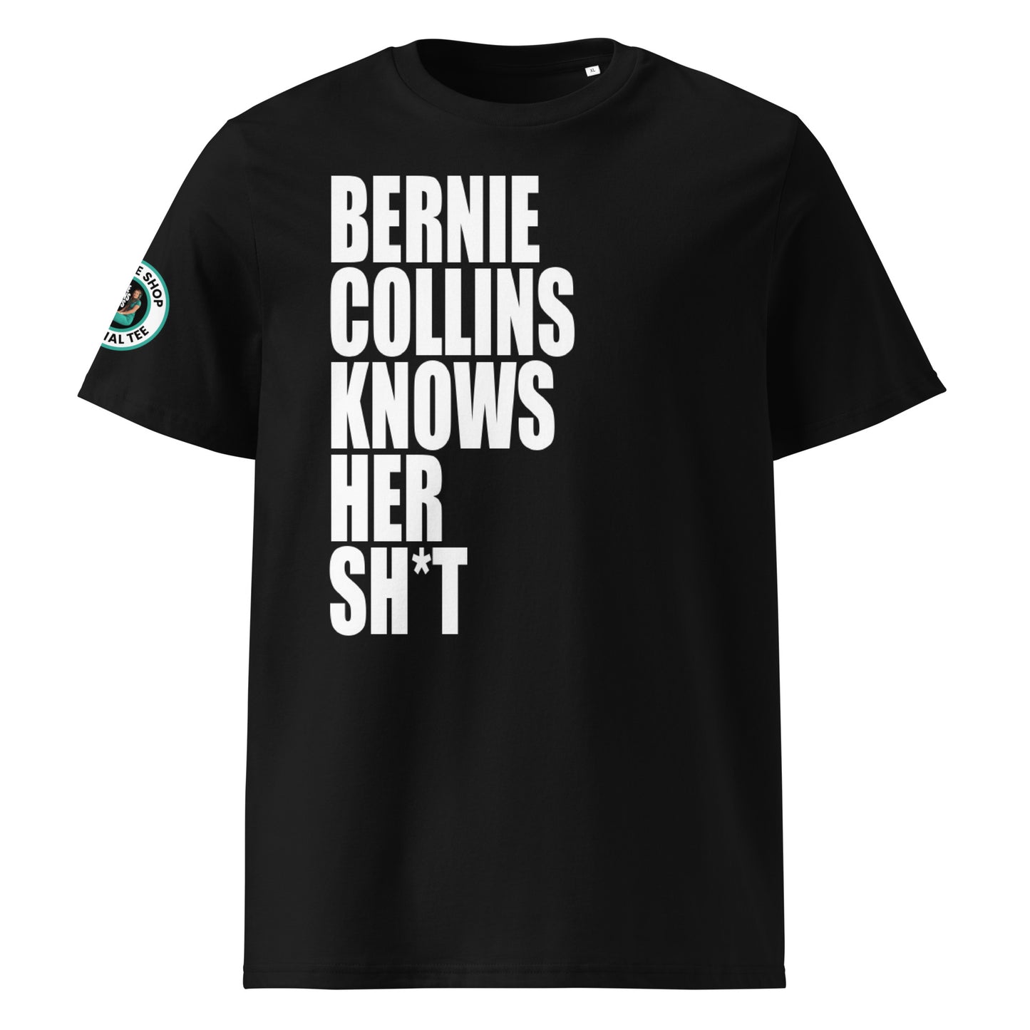 Front view of black unisex t-shirt with bold white slogan “BERNIE COLLINS KNOWS HER SH*T” in crisp font across the chest. DTF print, perfect for F1 and Sky Sports fans.