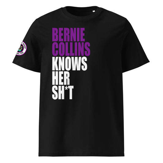 Front view of black unisex t-shirt with bold slogan: “BERNIE COLLINS” in purple (F1 purple sector) and “KNOWS HER SH*T” in white, stacked vertically. DTF print, perfect for F1 and Sky Sports fans.