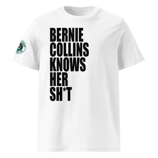 Front view of white unisex t-shirt with bold black slogan “BERNIE COLLINS KNOWS HER SH*T” in crisp font across the chest. DTF print, perfect for F1 and Sky Sports fans.