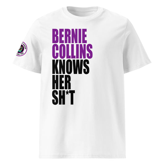 Front view of white unisex t-shirt with bold slogan: “BERNIE COLLINS” in purple (F1 purple sector) and “KNOWS HER SH*T” in black, stacked vertically. DTF print, perfect for F1 and Sky Sports fans.