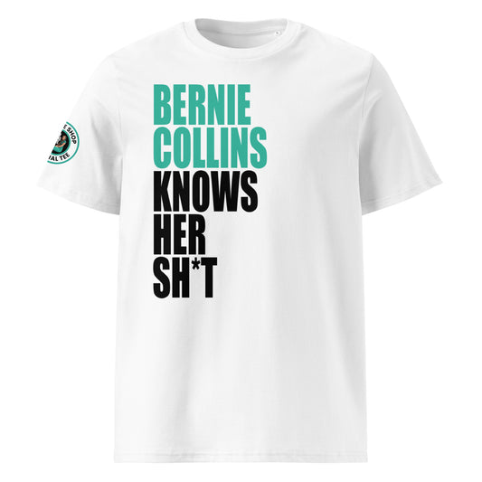 Front view of white unisex t-shirt with bold slogan: “BERNIE COLLINS” in teal and “KNOWS HER SH*T” in black, stacked vertically. DTF print, perfect for Mercedes and F1 fans.
