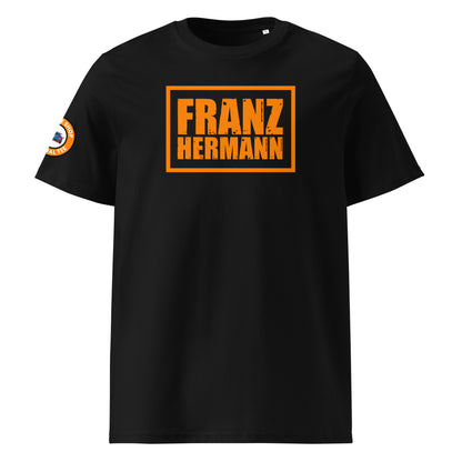 Front view of black unisex t-shirt with a bold, distressed orange “Franz Hermann” box logo printed on the chest. DTF print, Dutch-inspired, motorsport style for F1 fans.