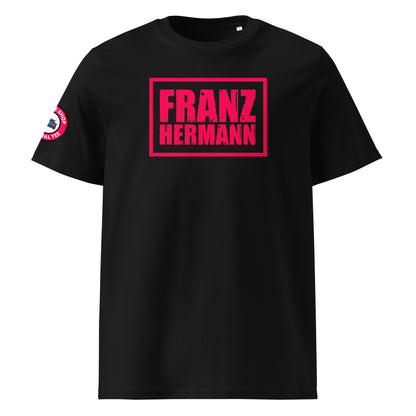 Front view of black unisex t-shirt with bold, distressed Red Bull Racing pink “Franz Hermann” box logo printed on the chest. DTF print, inspired by Verstappen’s Nürburgring GT3 moment. Modern F1 fan style.