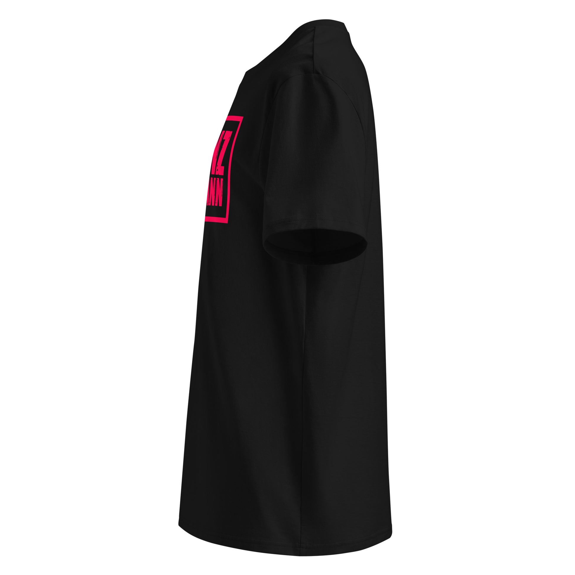 Left side view of black unisex t-shirt, plain sleeve, visible side of distressed Red Bull Racing pink Franz Hermann box logo. Minimalist, F1 fan style.
