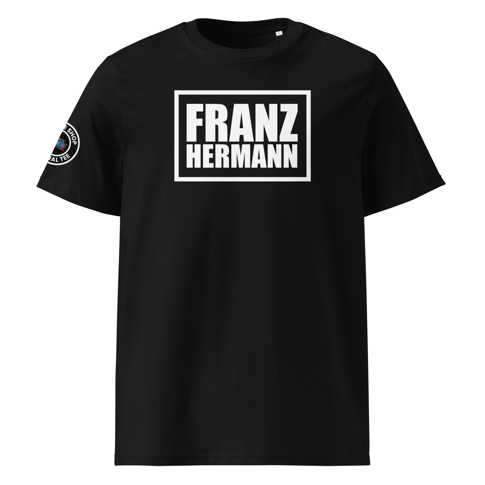 Front view of black unisex t-shirt with bold white “Franz Hermann” box logo printed on the chest. DTF print, inspired by Max Verstappen’s Nürburgring GT3 radio moment. Clean, professional motorsport style.

