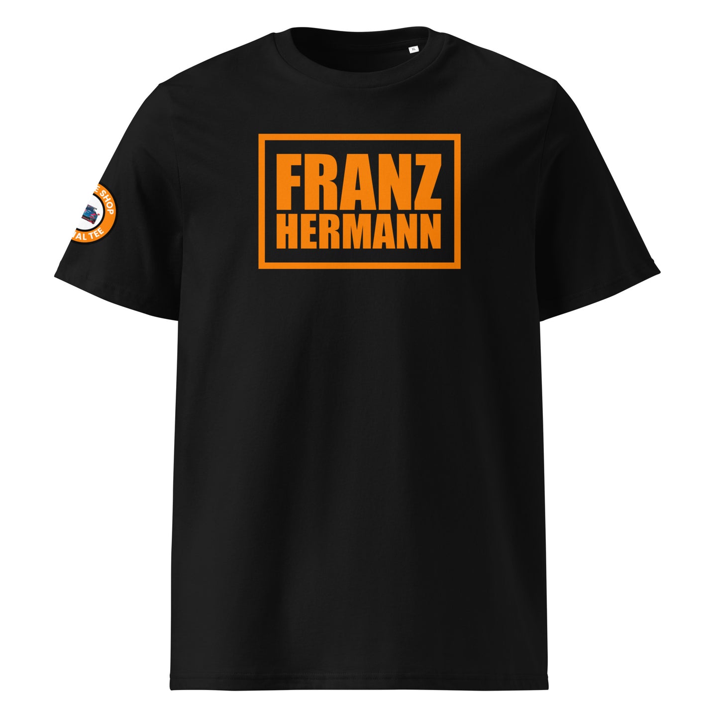 Front view of black unisex t-shirt with bold orange “Franz Hermann” box logo printed on the chest. DTF print, Dutch-inspired for Max Verstappen and F1 fans. Clean, professional motorsport style.