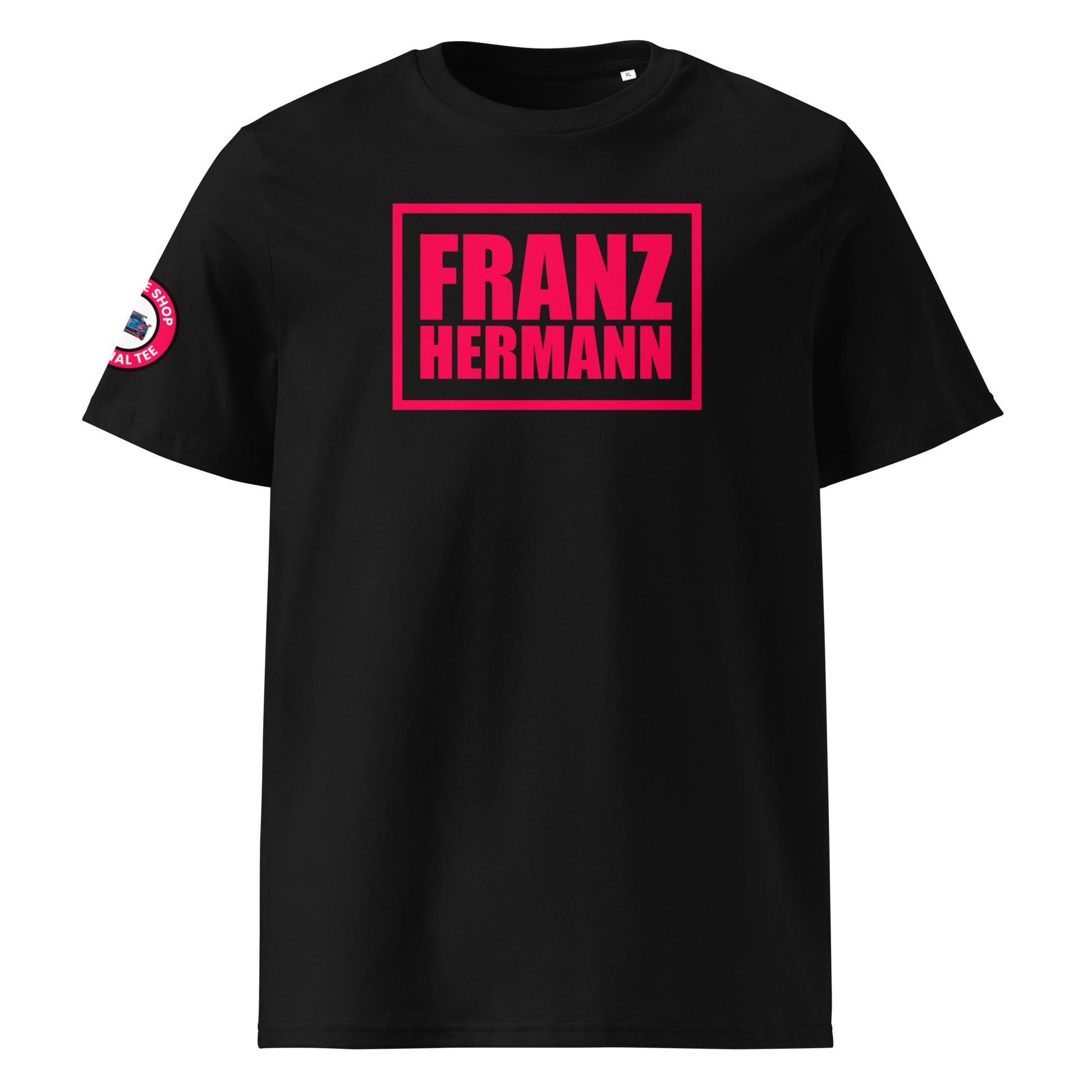 Front view of black unisex t-shirt with bold Red Bull Racing pink “Franz Hermann” box logo printed on the chest. DTF print, inspired by Verstappen and Nürburgring GT3. Motorsport style for F1 fans.