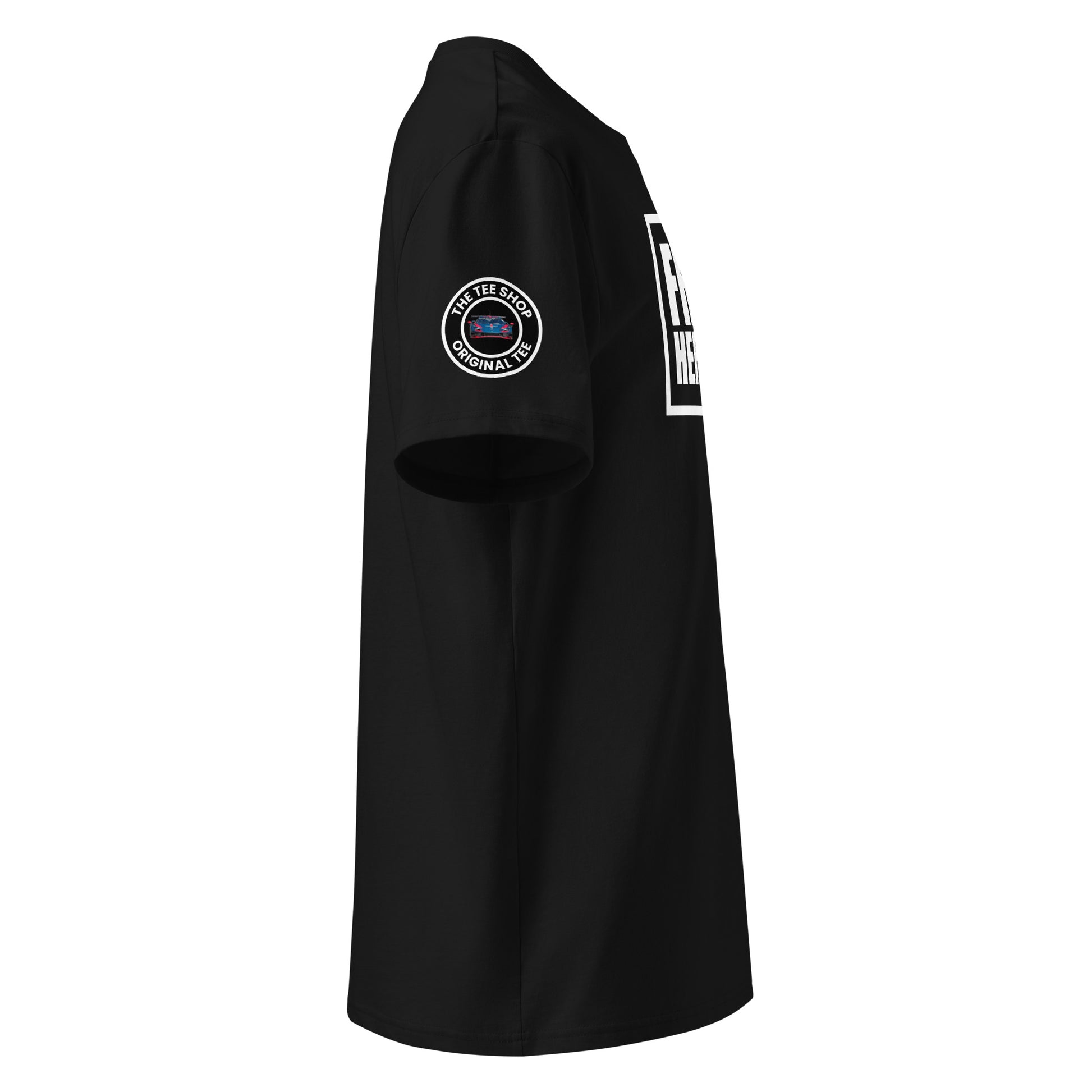Right side view of black t-shirt showing The Tee Shop’s circular logo patch on the sleeve and the edge of the white Franz Hermann box logo. DTF printed, motorsport-inspired design for F1 fans.
