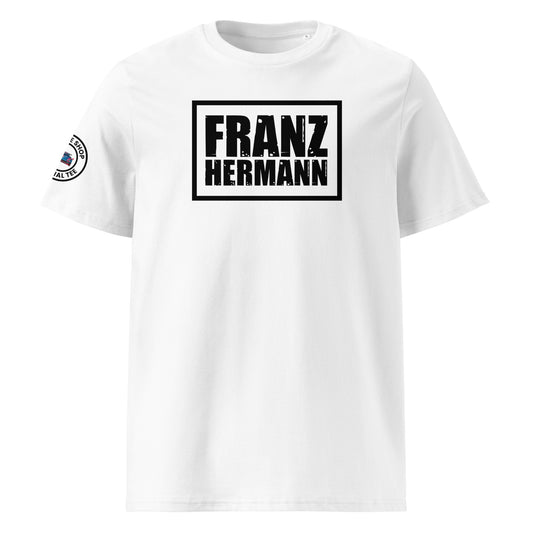 Front view of white unisex t-shirt with a bold, distressed black “Franz Hermann” box logo printed on the chest. DTF print, inspired by Verstappen’s Nürburgring GT3 radio moment. Rugged motorsport style for F1 fans.