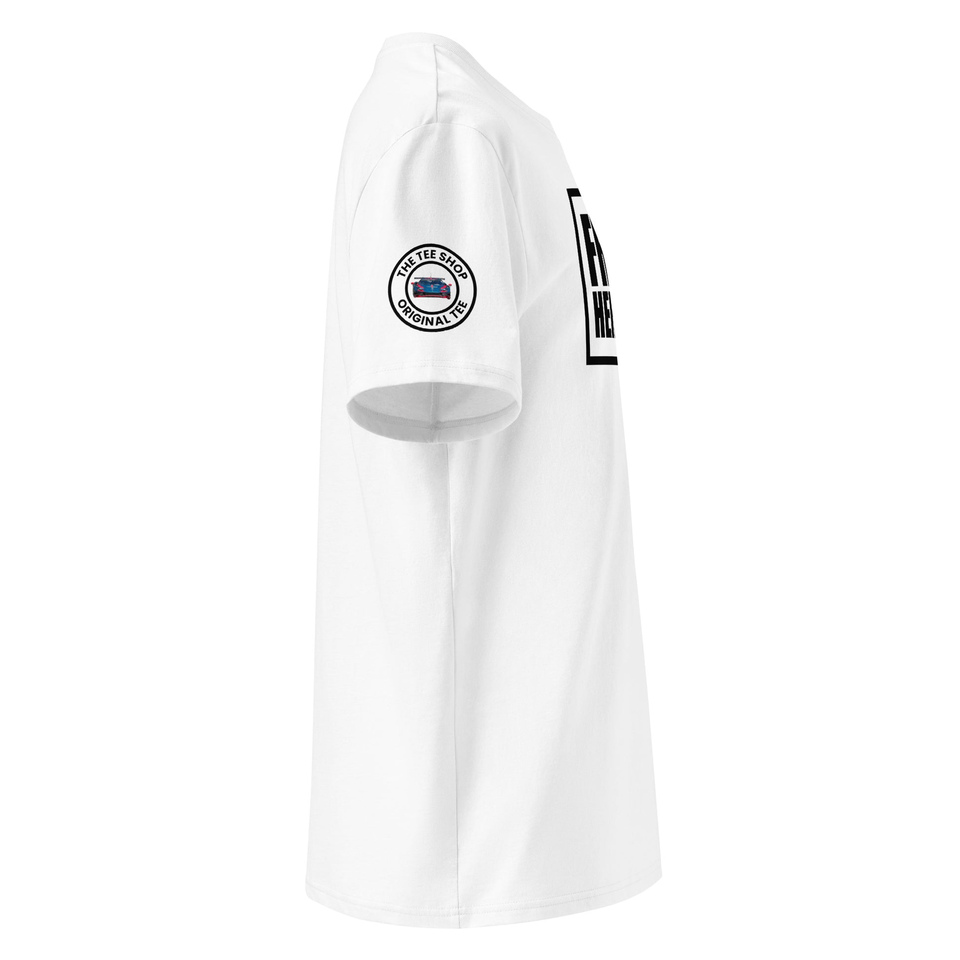 Right side view of white t-shirt showing The Tee Shop’s circular donut logo patch on the sleeve and the edge of the Franz Hermann box logo. DTF printed, motorsport-inspired design for F1 fans.
