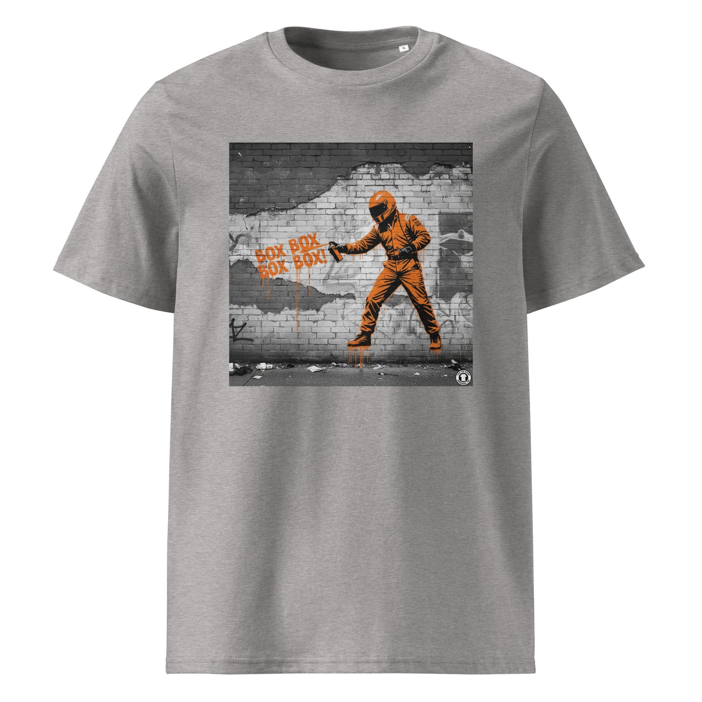 Heather Grey organic cotton F1 t-shirt with BOX BOX graffiti art of an F1 car on a brick wall, showcasing bold papaya orange and black design by TheTeeShop.