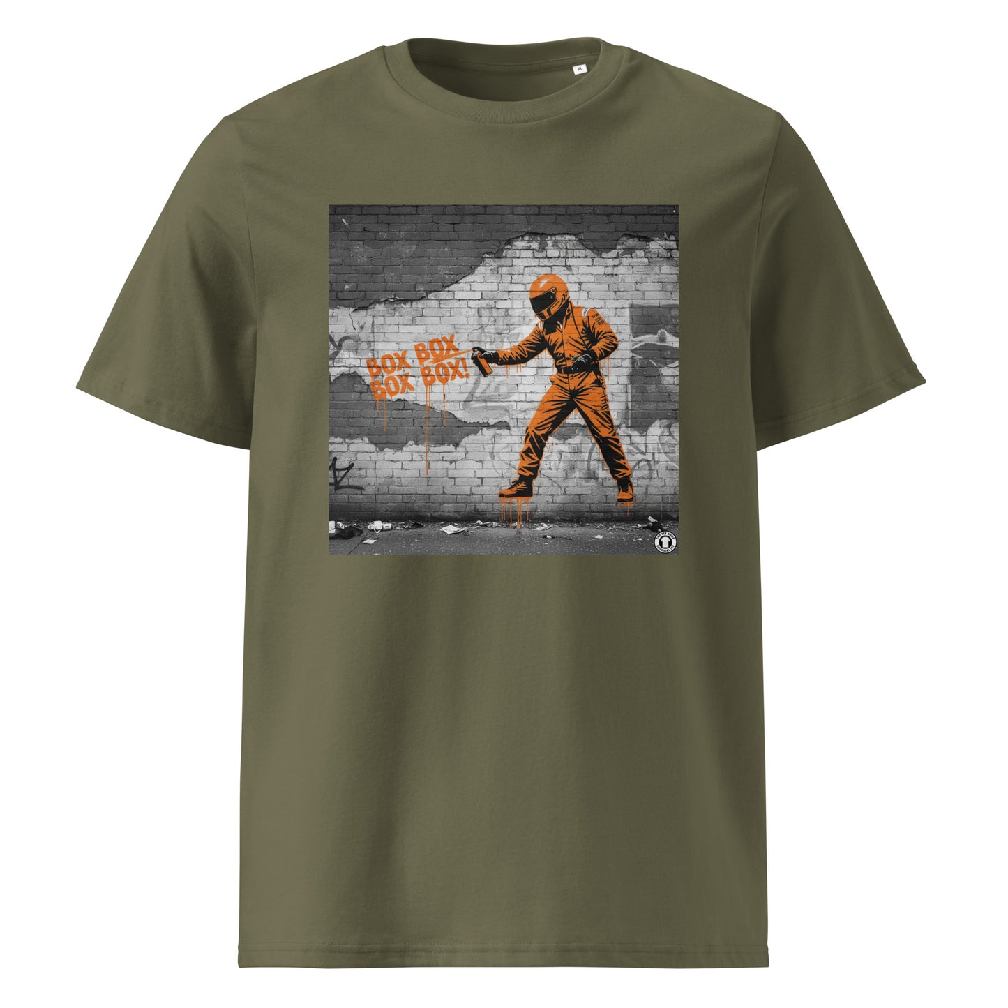 Khaki organic cotton F1 t-shirt with BOX BOX graffiti art of an F1 car on a brick wall, showcasing bold papaya orange and black design by TheTeeShop.