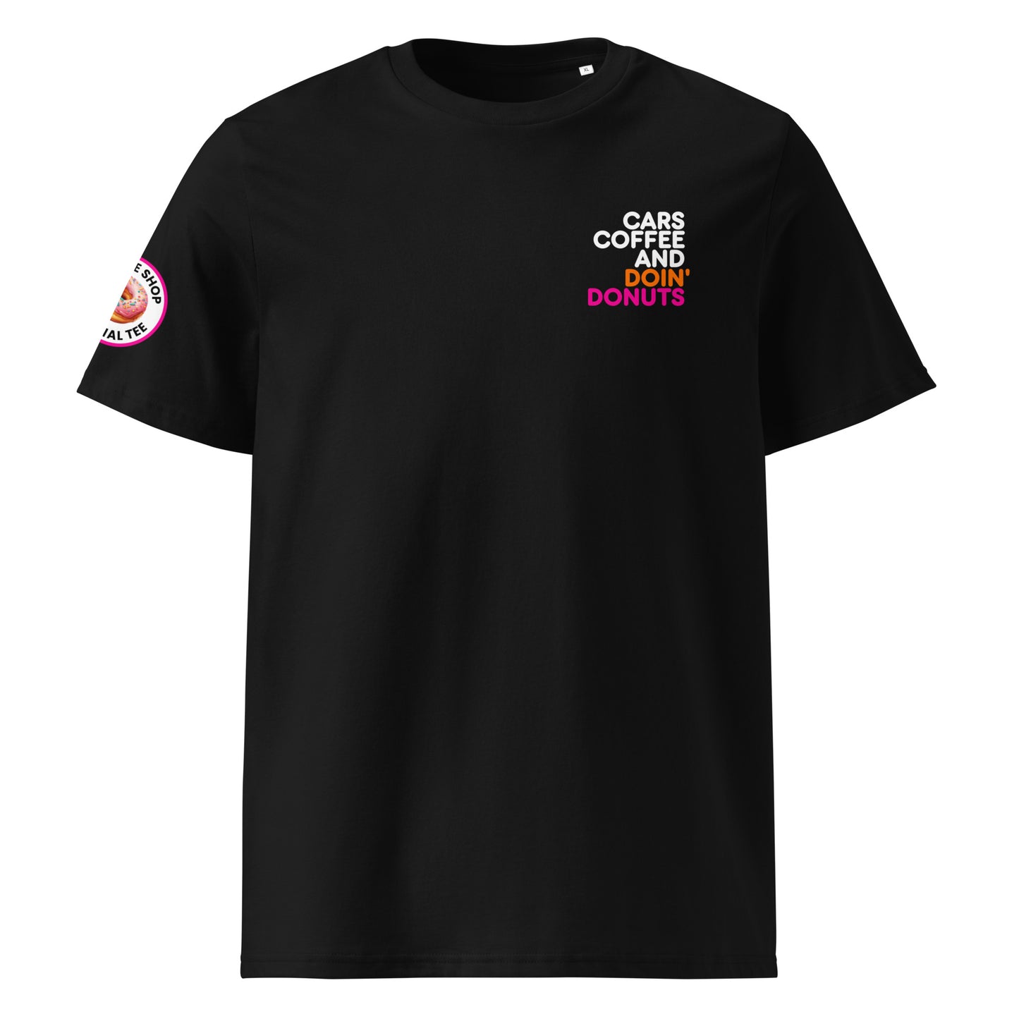 Black unisex t-shirt with small “Cars Coffee and Doin’ Donuts” slogan printed on the right chest in white, orange, and pink. Features The Tee Shop donut logo patch on right sleeve. Minimalist car meet tee, DTF printed for lasting colour.