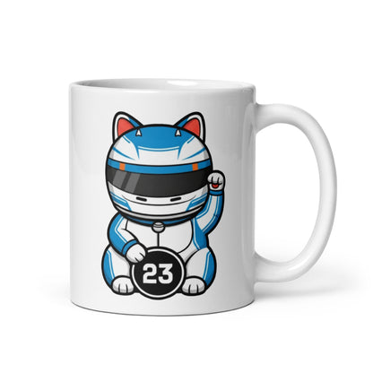 Motorsport-inspired lucky cat mug with blue-and-white kit styling and #23 coin detail - perfect for race mornings, desk flex energy, and cat-approved setups.