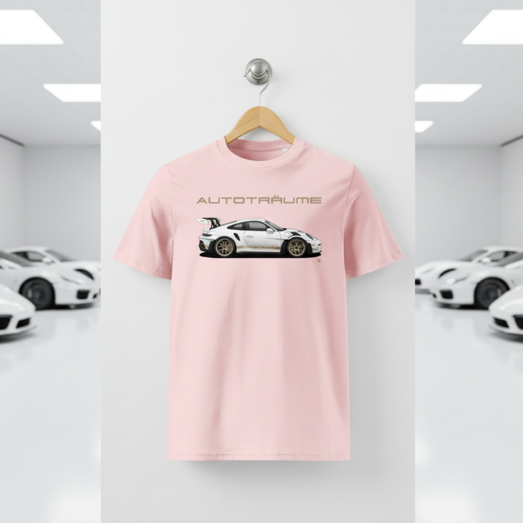 Cotton pink unisex organic cotton AUTOTRÄUME GT3 RS T-shirt featuring a large, centred white Porsche-style GT3 RS car graphic with gold details hanging on a premium wooden hanger with a silver wall peg against a clean white wall panel in a bright modern sports car gallery with glossy floors and blurred white and silver sports cars on both sides.