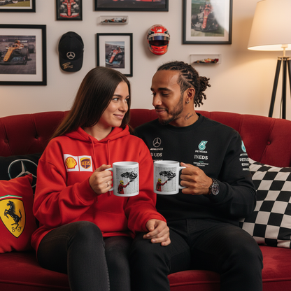 A couple of Lewis Hamilton and Ferrari fans relaxing together, both holding the Humble Beginnings Graffiti Mug, surrounded by F1 memorabilia.