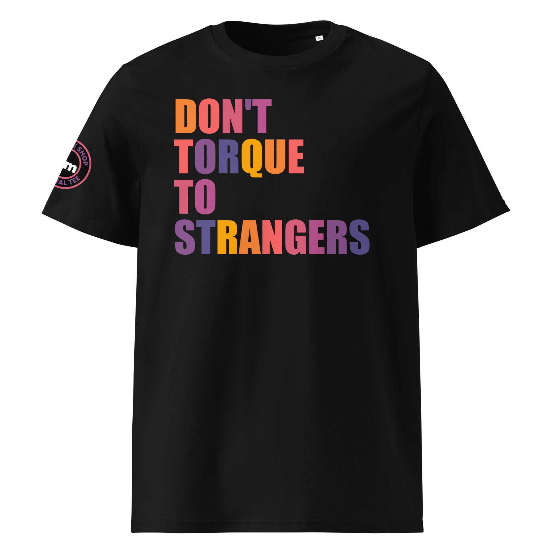 Front view of black unisex t-shirt with “DON’T TORQUE TO STRANGERS” slogan in multi-colour harlequin print. DTF print, perfect for car meets, torque fans, and petrolhead banter.