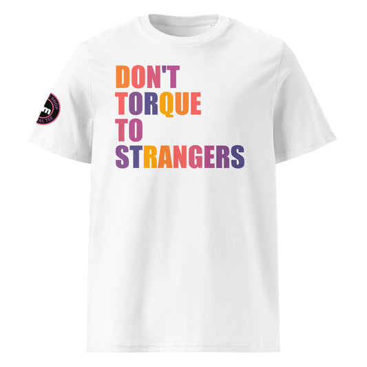 Front view of white unisex t-shirt with “DON’T TORQUE TO STRANGERS” slogan in multi-colour harlequin print. DTF print, perfect for car meets, torque fans, and petrolhead banter.