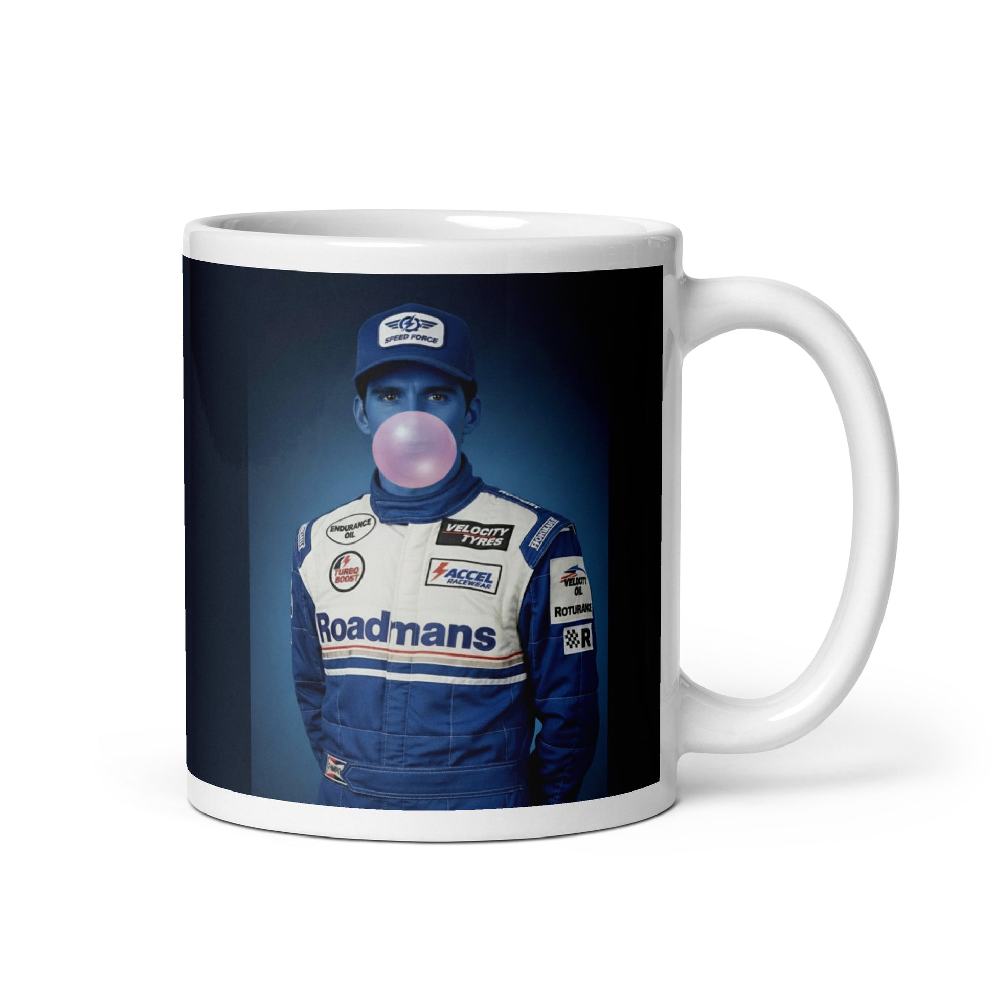 White ceramic 11oz mug featuring a pop-art style portrait of Damon Hill in a blue racing suit and cap, blue-tinted face, and blowing a bubblegum bubble, set against a blue background.