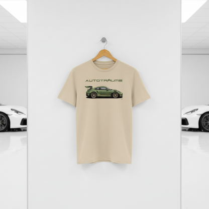 Desert dust AUTOTRÄUME GT3 T‑shirt with an olive green Porsche‑style car illustration hanging on a premium wooden hanger and silver peg against a central white wall in a bright sports car gallery, with a glossy white floor and blurred white and silver sports cars running down both sides.