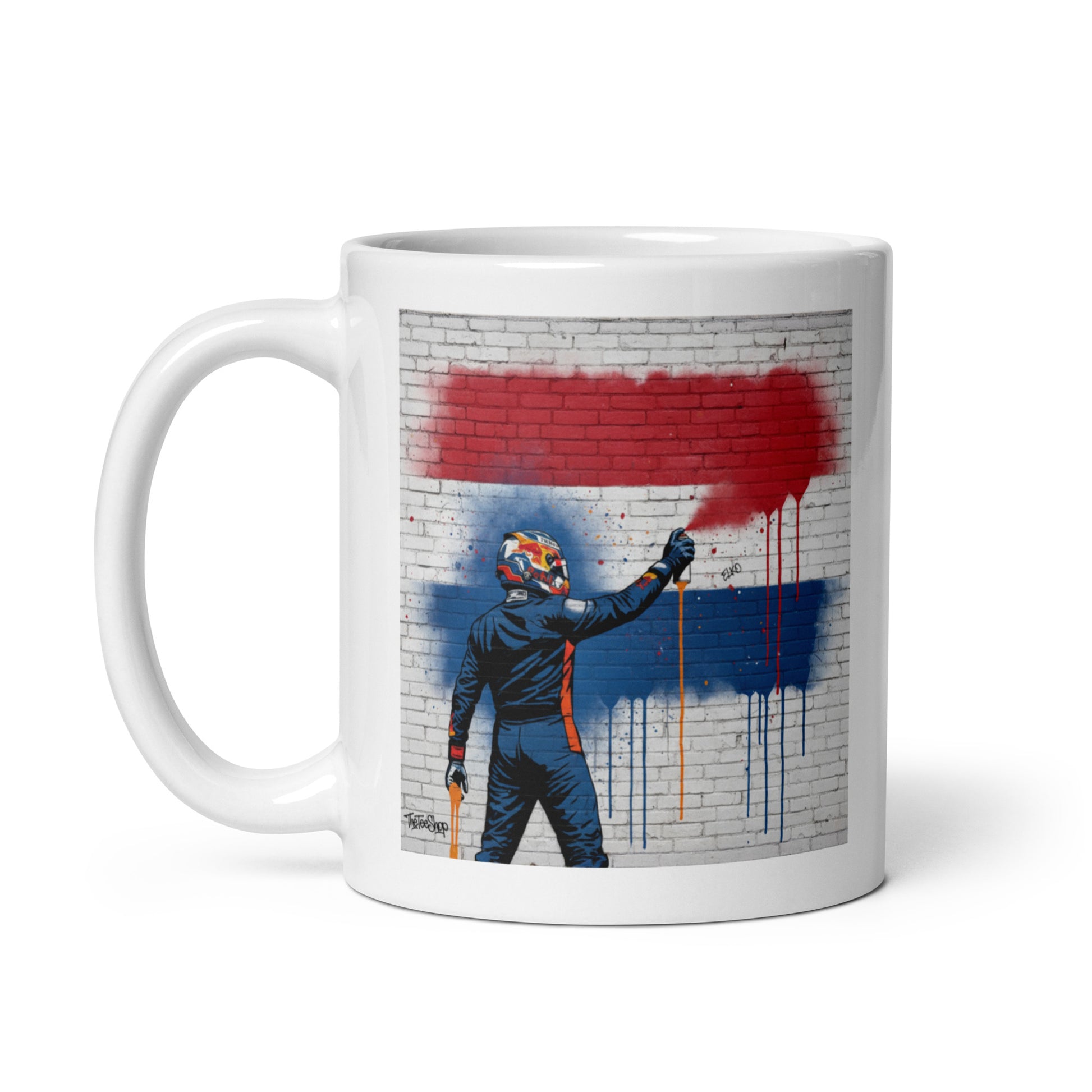 White ceramic 11oz mug featuring a street art illustration of a racing driver spray-painting the red, white, and blue Dutch flag on a brick wall.