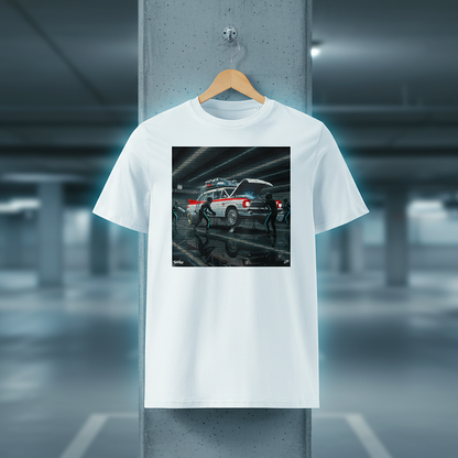 White ECTO 1 Pitstop Car Meet T‑Shirt with a futuristic ambulance-style car pit stop graphic hanging on a wooden hanger in an underground car park, with concrete background and cool blue lighting.