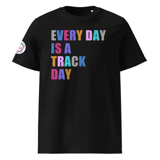 Front view of black unisex t-shirt with “EVERY DAY IS A TRACK DAY” slogan in multi-colour harlequin print across the chest. DTF print, perfect for motorsport and car meet fans.