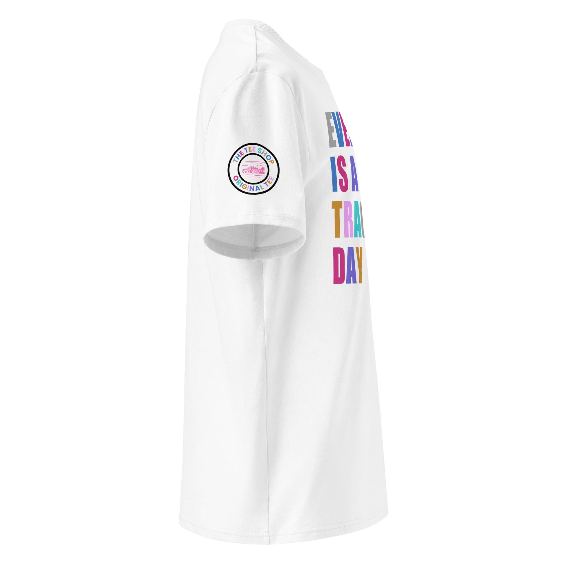 Right side view of white t-shirt showing The Tee Shop’s unique race car logo on the sleeve and edge of the multi-colour “EVERY DAY IS A TRACK DAY” front print. DTF print, motorsport-inspired style.