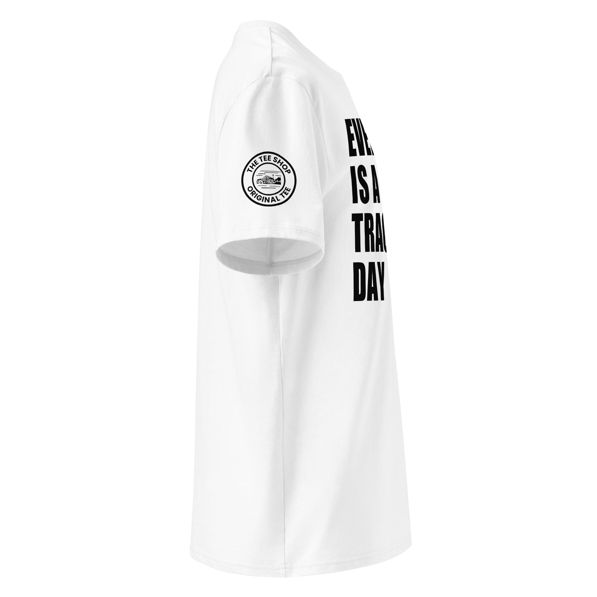 Right side view of white t-shirt showing The Tee Shop’s unique race car logo on the sleeve and edge of the bold “EVERY DAY IS A TRACK DAY” front print. DTF print, motorsport-inspired style.