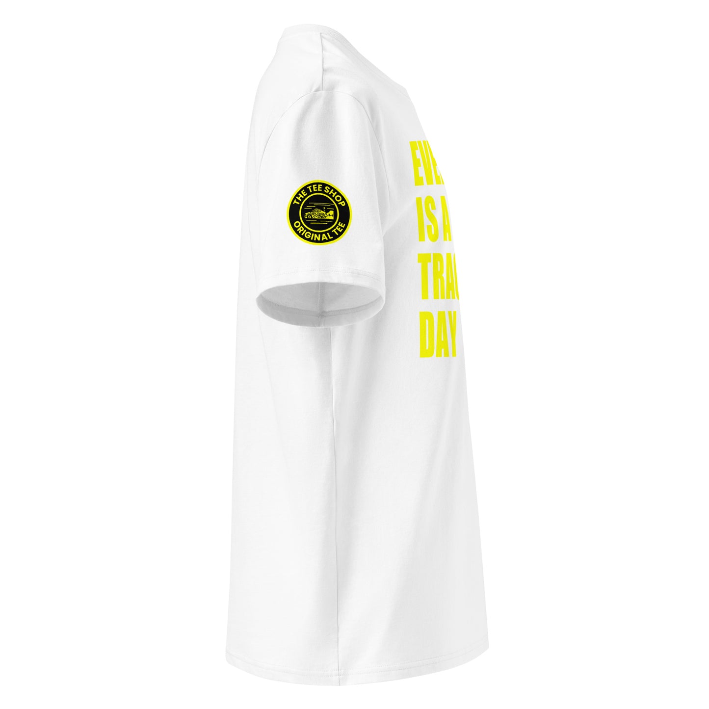 Right side view of white t-shirt showing The Tee Shop’s unique race car logo on the sleeve and edge of the yellow “EVERY DAY IS A TRACK DAY” front print. DTF print, motorsport-inspired style.