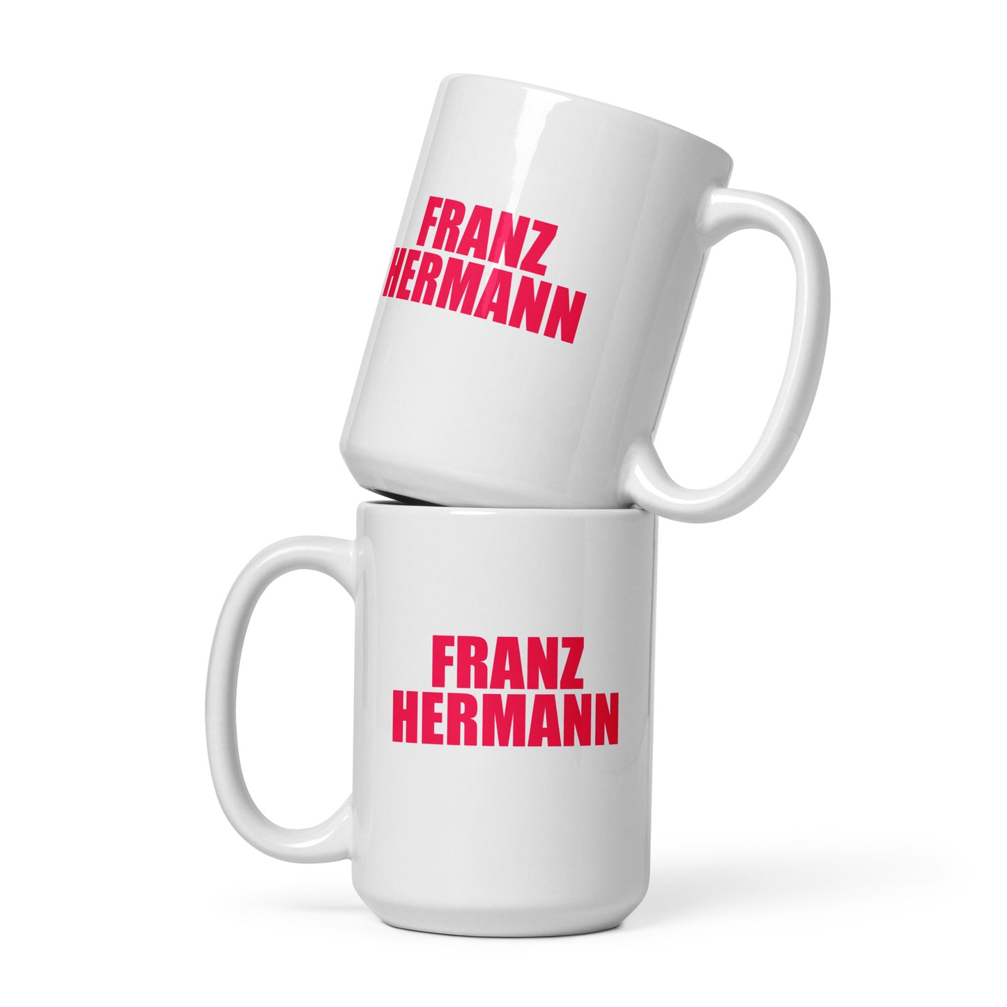 Front view of the Franz Hermann Mug in white, featuring bold RedBull pink lettering and a tribute to Verstappen’s Ferrari GT3 run. 15 oz size ideal for hot chocolate.