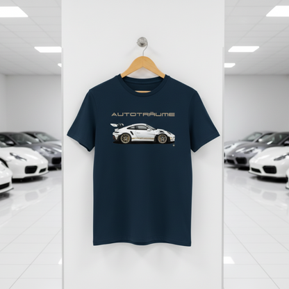 French Navy AUTOTRÄUME GT3 RS T-shirt featuring a white Porsche-style GT3 RS car graphic with gold details hanging on a premium wooden hanger with a silver wall peg against a central white wall panel in a bright sports car gallery with glossy white floors and blurred white and silver sports cars on both sides.