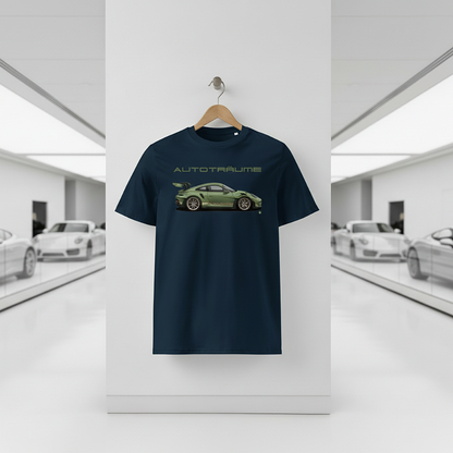 French navy AUTOTRÄUME GT3 T‑shirt with an olive green Porsche‑style car illustration hanging on a premium wooden hanger and silver peg against a central white wall in a bright sports car gallery, with a glossy white floor and blurred white and silver sports cars running down both sides.