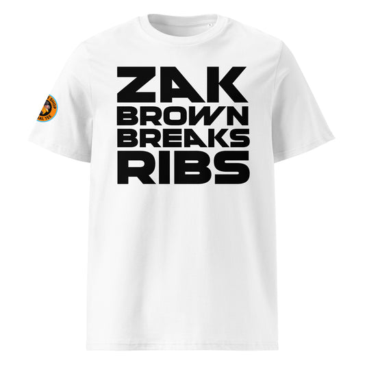 Front View: The front of the t-shirt features the bold "Zak Brown Breaks Ribs" print in black writing on a white background, capturing the humour and excitement of Zak Brown's famous celebrations.