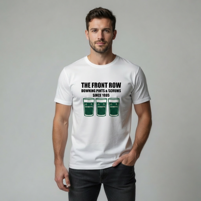 Male model in studio on light grey background wearing a white t‑shirt reading “THE FRONT ROW DOWNING PINTS & SCRUMS SINCE 1885”.
