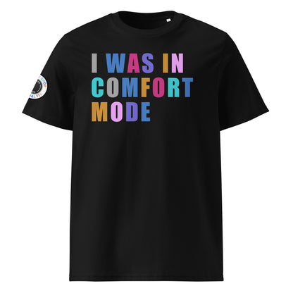 Front view of black unisex t-shirt with “I WAS IN COMFORT MODE” slogan in multi-colour harlequin print across the chest. DTF print, playful car meet and petrolhead style.