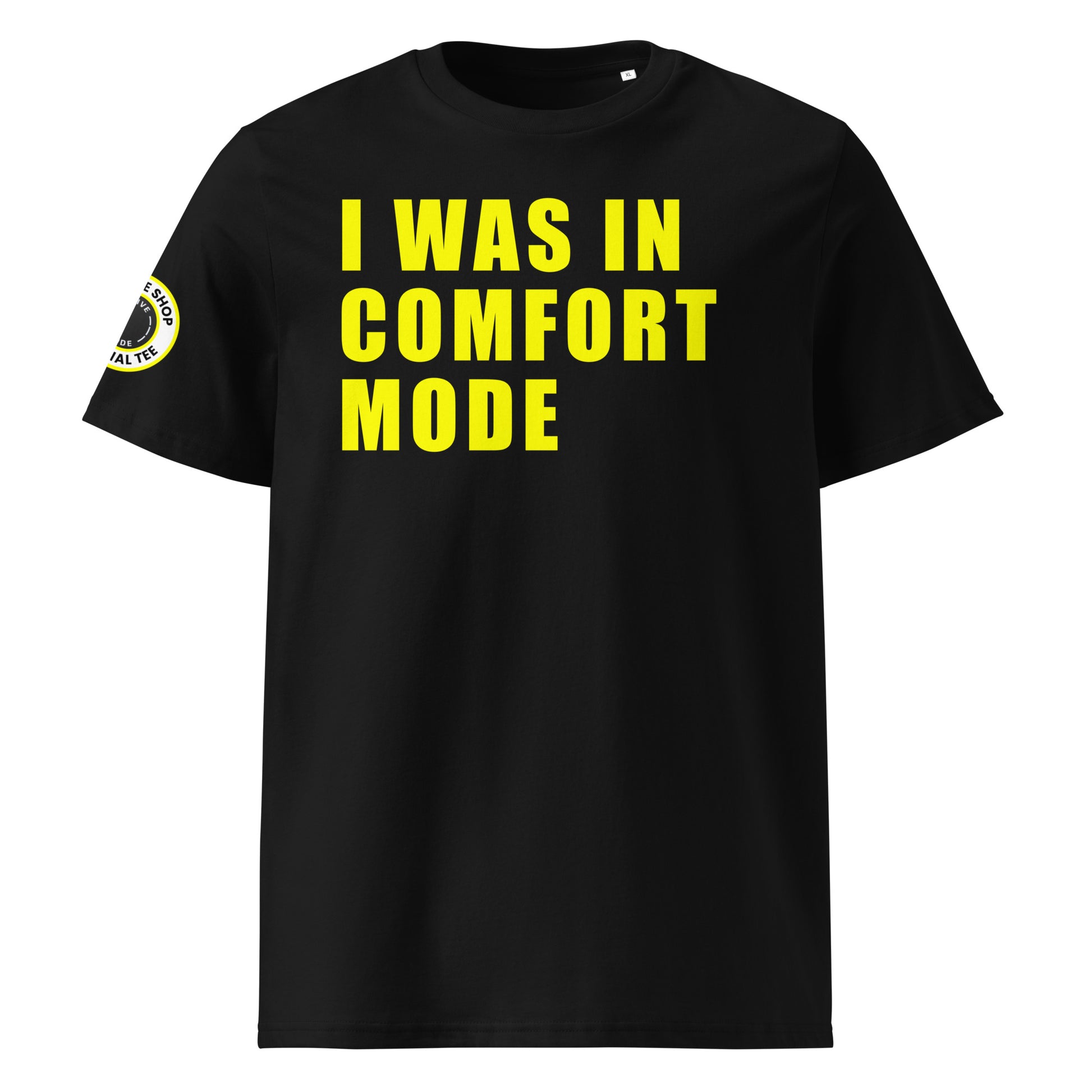 Front view of black unisex t-shirt with bold yellow “I WAS IN COMFORT MODE” slogan in large font across the chest. DTF print, perfect for car meet fans and petrolheads.