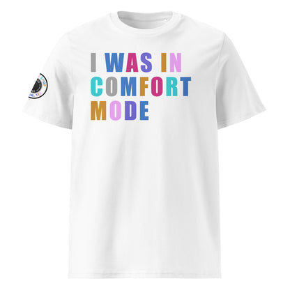 Front view of white unisex t-shirt with “I WAS IN COMFORT MODE” slogan in multi-colour harlequin print across the chest. DTF print, playful car meet and petrolhead style.
