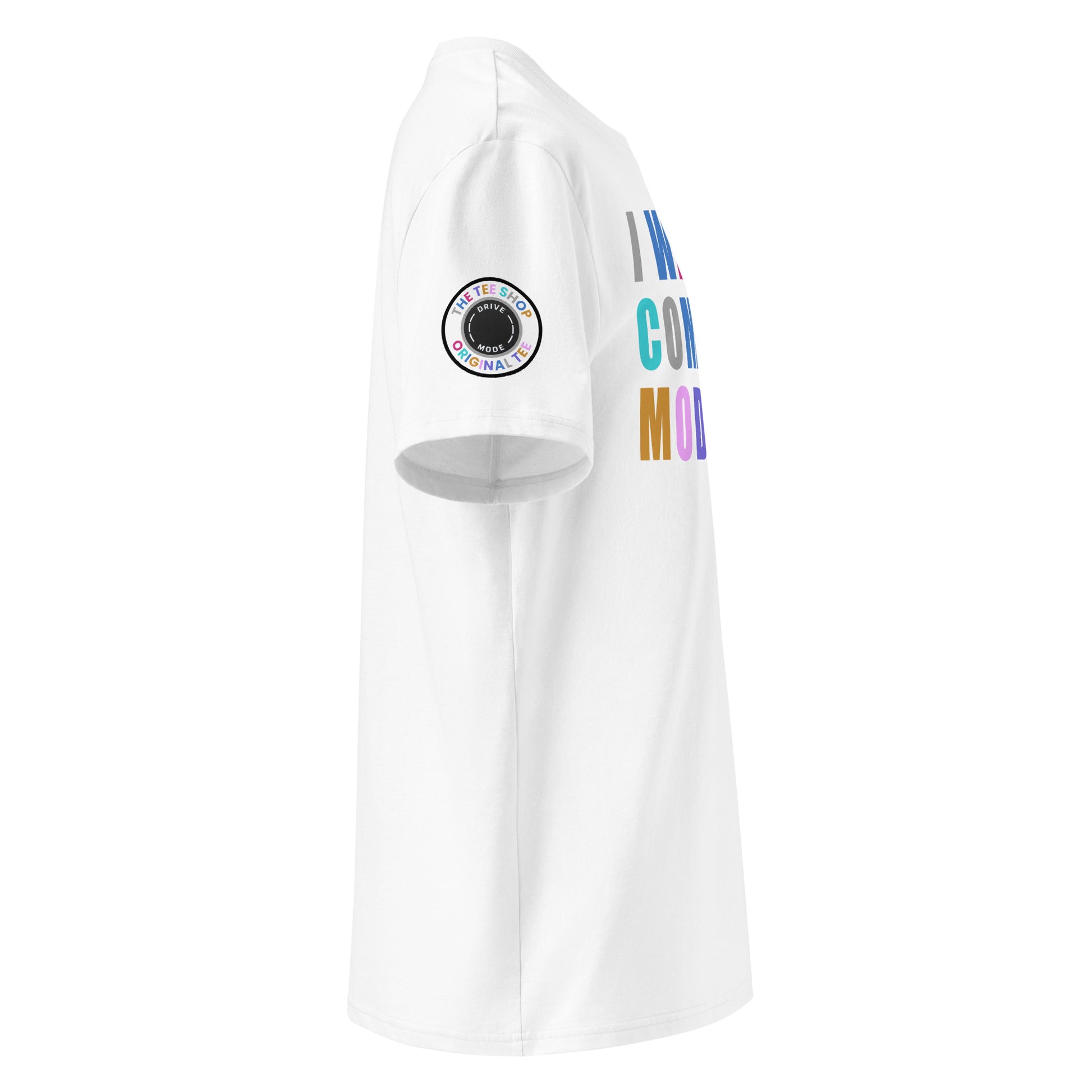 Right side view of white t-shirt showing The Tee Shop’s drive mode button patch on the sleeve and edge of the multi-colour “I WAS IN COMFORT MODE” chest print. DTF print, car culture style.