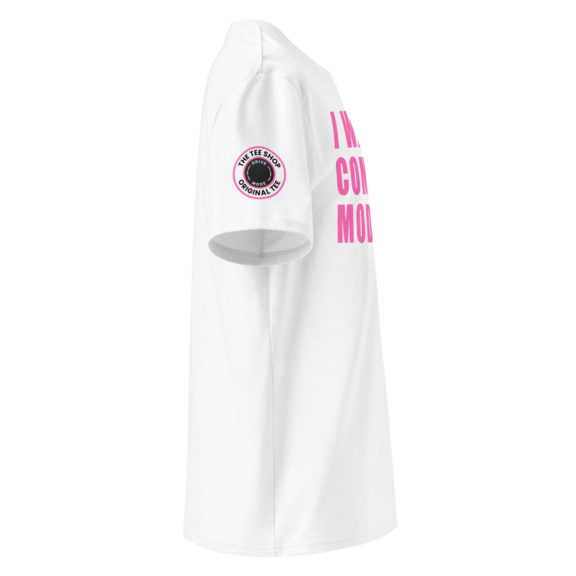 Right side view of white t-shirt showing The Tee Shop’s drive mode button logo patch on the sleeve and edge of the pink “I WAS IN COMFORT MODE” chest print. DTF print, car culture style.