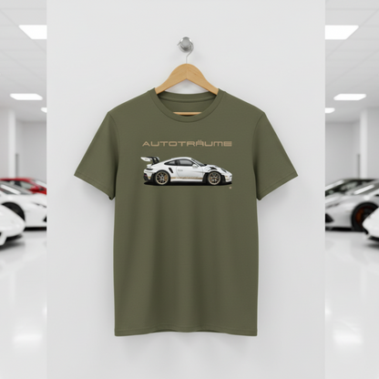 Khaki unisex organic cotton AUTOTRÄUME GT3 RS T-shirt featuring a large, centred white Porsche-style GT3 RS car graphic with gold details hanging on a premium wooden hanger with a silver wall peg against a clean white wall panel in a bright modern sports car gallery with glossy floors and blurred white and silver sports cars on both sides.