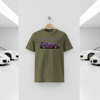 Khaki AUTOTRÄUME GT3 T‑shirt with a purple Porsche‑style car illustration hanging on a premium wooden hanger and silver wall peg against a central white wall in a bright sports car gallery, with a glossy white floor and blurred white and silver sports cars running down both sides.