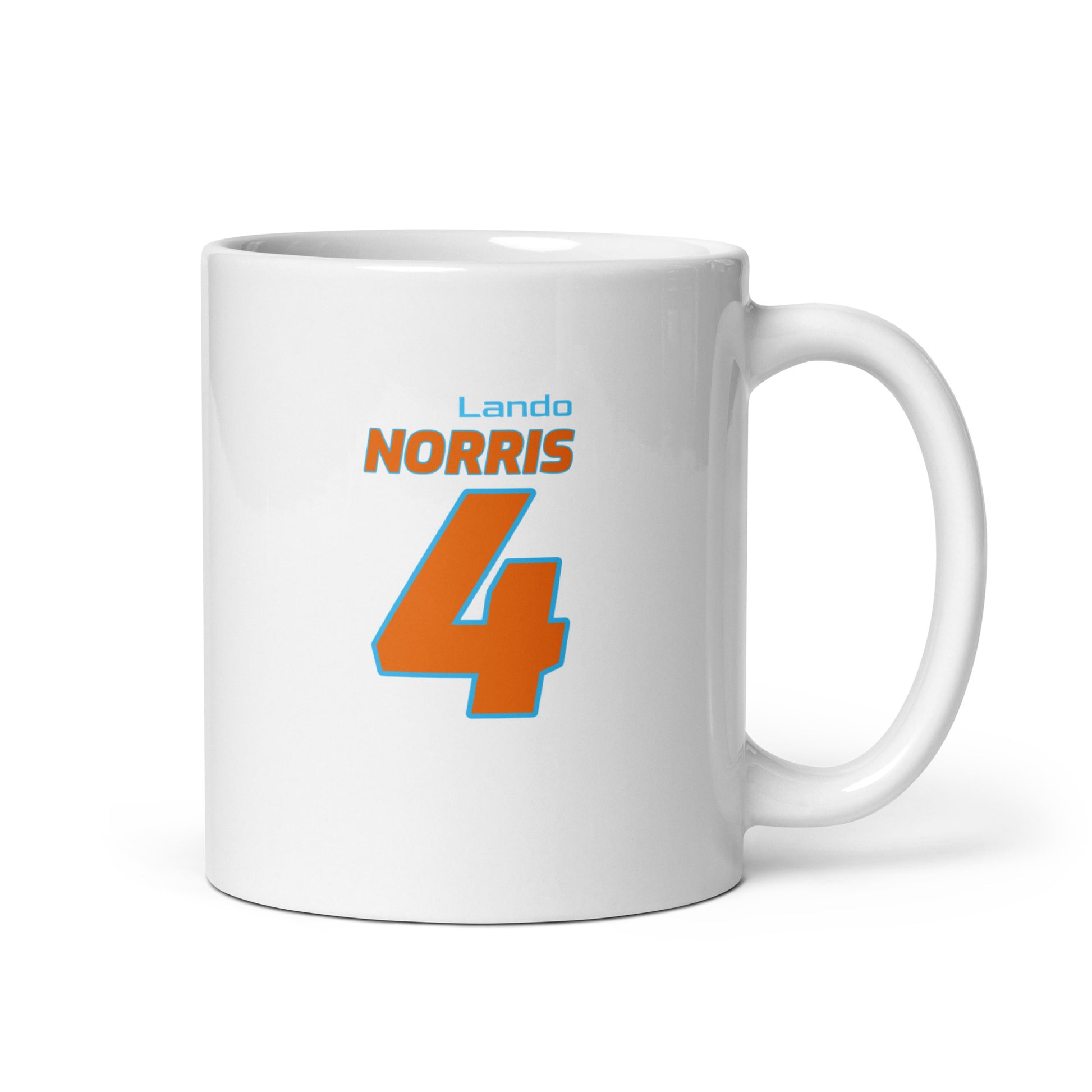 Fuel your mornings with the Lando Norris Racing Mug! This sleek ceramic mug features Lando Norris's name and number "4" in bold McLaren team colours of orange and light blue. Perfect for enjoying your favourite beverage while watching the Grand Prix, as a gift for a motorsport enthusiast, or as a collectible item. Whether you're a dedicated fan or looking for the perfect gift, this mug is a must-have addition to your collection.