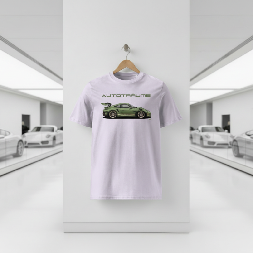 Lavender AUTOTRÄUME GT3 T‑shirt with an olive green Porsche‑style car illustration hanging on a premium wooden hanger and silver peg against a central white wall in a bright sports car gallery, with a glossy white floor and blurred white and silver sports cars running down both sides.