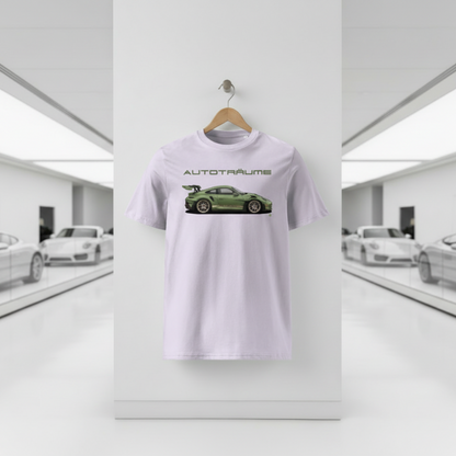 Lavender AUTOTRÄUME GT3 T‑shirt with an olive green Porsche‑style car illustration hanging on a premium wooden hanger and silver peg against a central white wall in a bright sports car gallery, with a glossy white floor and blurred white and silver sports cars running down both sides.