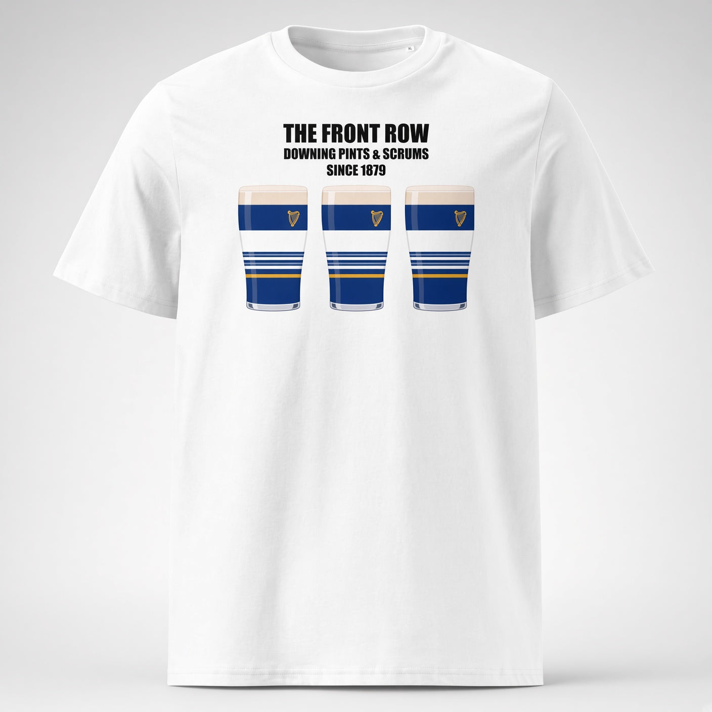 White Leinster rugby t-shirt reading “The Front Row - Downing Pints & Scrums Since 1879” with three blue striped pint graphics featuring a harp crest for Leinster match day supporters