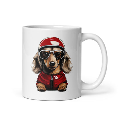 White ceramic 11oz mug featuring a playful illustration of Leo Leclerc, a dachshund wearing sunglasses, a racing helmet, and a red jacket, inspired by quick dogs.